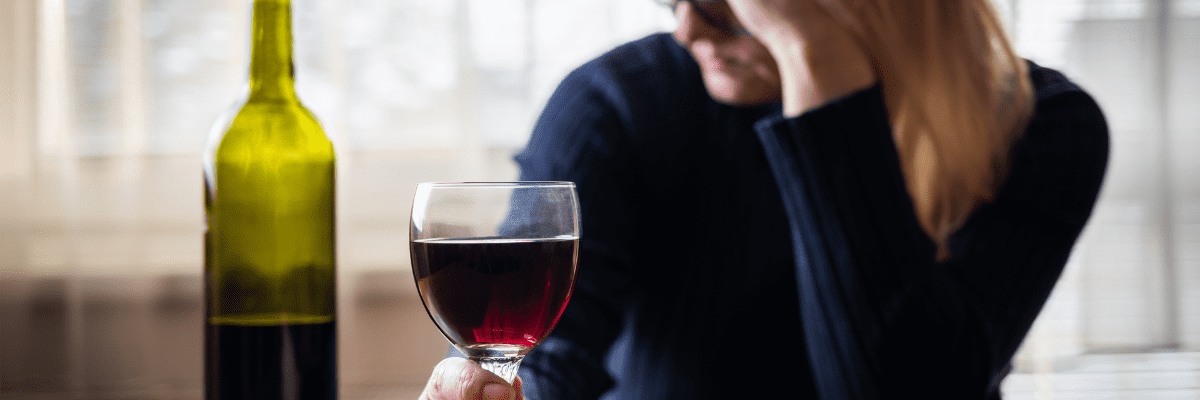 Sad woman drinking wine Sad woman drinking wine